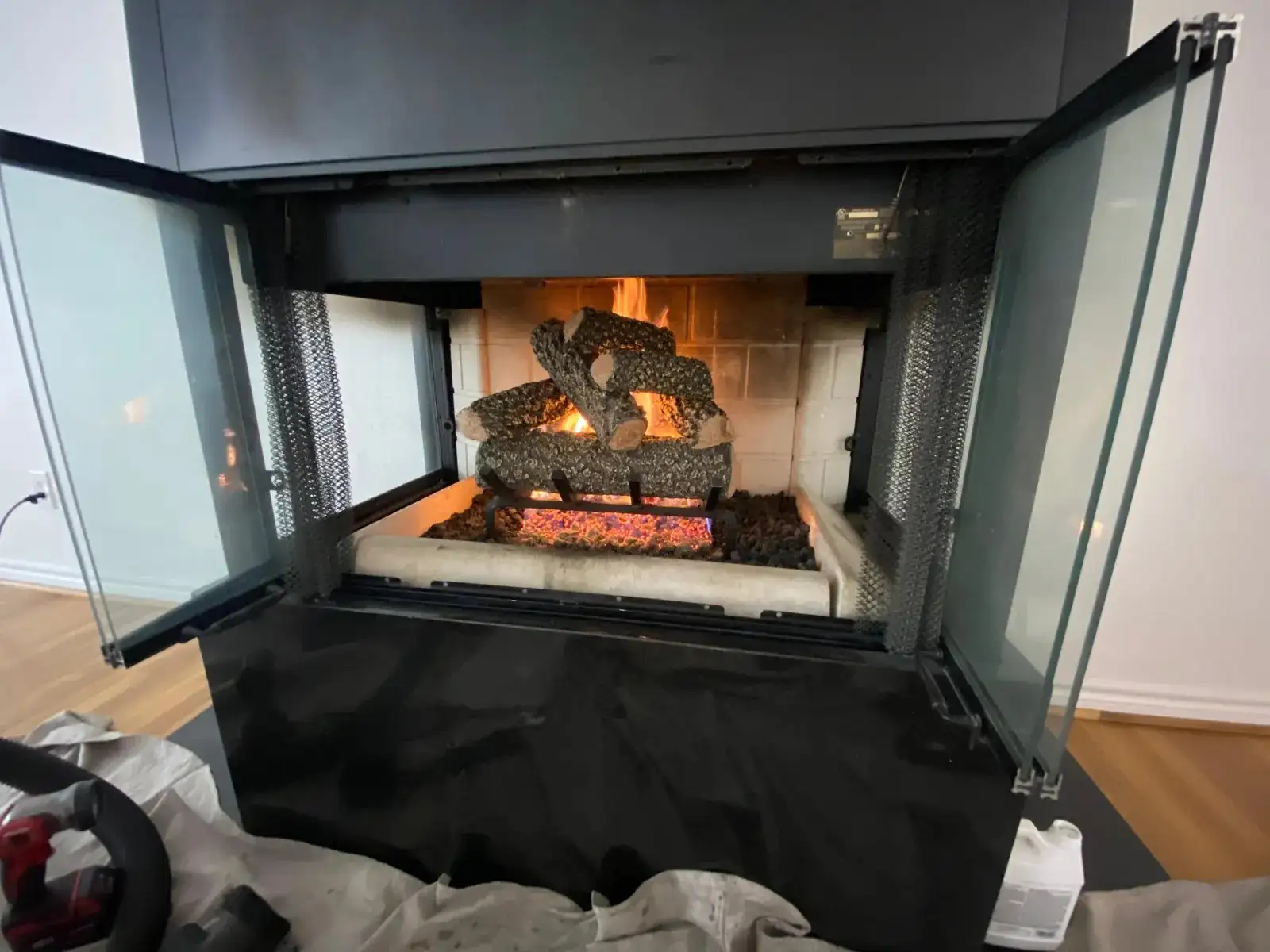 Gas fireplace with a new log set installed by Ember technicians