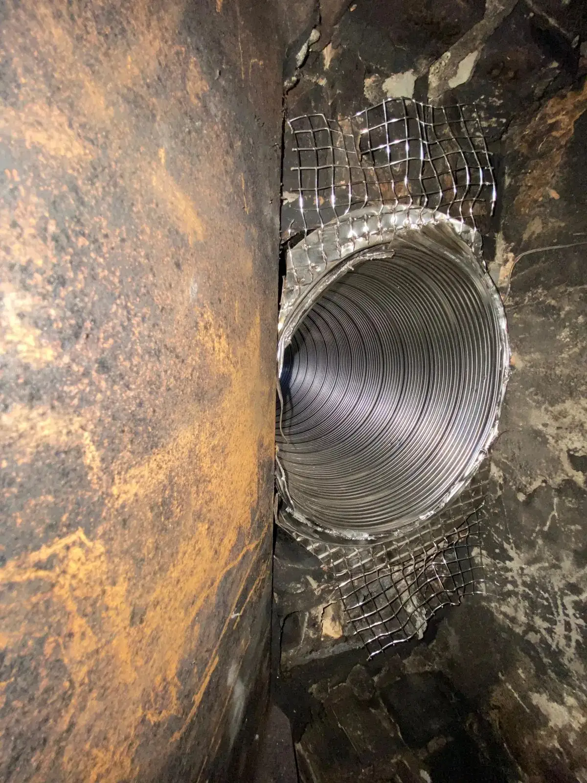 Stainless steel chimney liner seen during an Ember chimney inspection