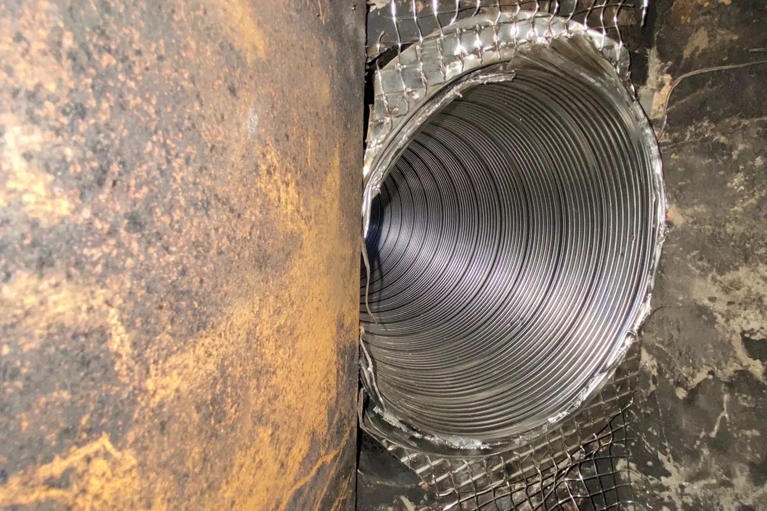 Stainless steel chimney liner seen during an Ember chimney inspection